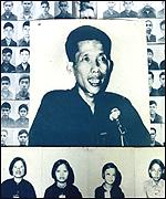 Duch, surrounded by his victims