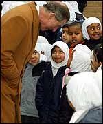 Prince Charles meets Muslim children during a visit to Leicester