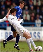 Harry Kewell of Leeds and Gillingham's Nicky Southall tangle at Priestfield