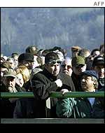 Mourners wait in line
