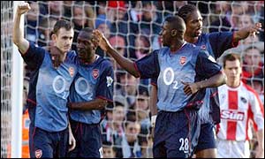 Francis Jeffers is congratulated by team-mates after scoring Arsenal's second after 23 minutes