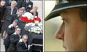 A tearful police officer looks on as the coffin is carried to the cathedral