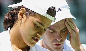 Eleni Daniilidou of Greece and Todd Woodbridge of Australia look shattered after defeat