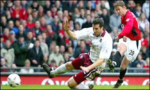 Ole Gunnar Solskjaer shoots past Ian Pearce to score the sixth