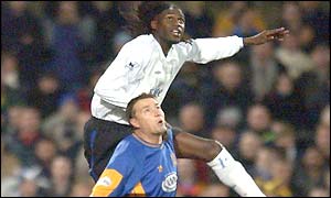 Mario Melchiot climbs above Nigel Jemson