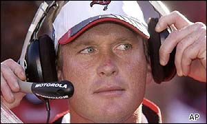 Tampa Bay Buccaneers head coach Jon Gruden adjusts his headphones 