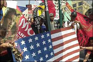 Philippines: Leftist protesters burn a US flag and a picture of President Bush in Manila