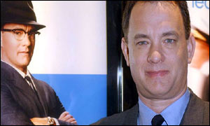 US actor Tom Hanks poses with a picture of himself at the Empire cinema in Leicester Square, London