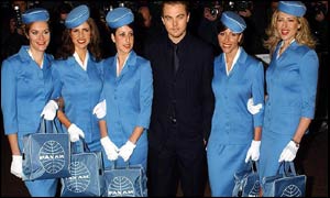US actor Leonardo DiCaprio arrives with some air stewardesses from the film Catch Me If You Can at the Empire cinema in Leicester Square, London
