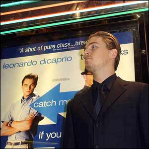 US actor Leonardo DiCaprio poses with a picture of himself at the Empire cinema in Leicester Square, London