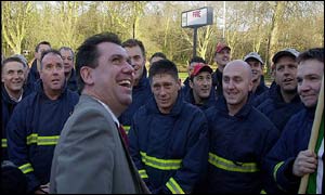 Fire Brigades Union general secretary Andy Gilchrist shares a joke with striking firefighters at Watford Fire Station, Hertfordshire