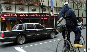 Election results flash up on New York sign-board