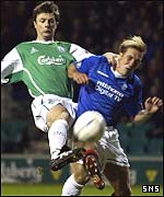 Paul Fenwick beats Rangers' Fernando Ricksen to the ball