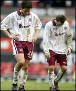 A dejected Joe Cole and Lee Bowyer after the defeat at Old Trafford