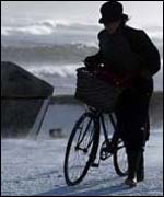 A cyclist struggles through the Whitley Bay blizzards