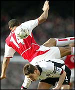 Arsenal's Thierry Henry challenges Fulham's Steve Finnan