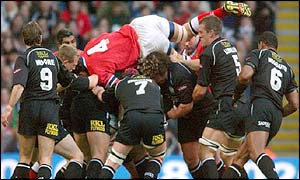 Mick O'Driscoll of Munster gets on top of the Neath pack whilst chasing the ball 
