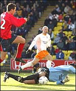 David McEwan saves at the feet of Kris Boyd