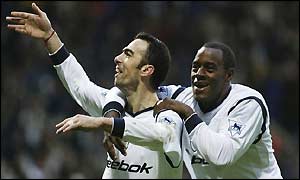 Djorkaef and Facey celebrate