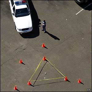 Police officer guards debris in Nacogdoches, Texas