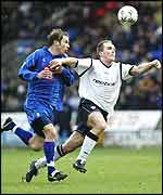 Henrik Pedersen of Bolton (right) takes on Kenny Cunningham