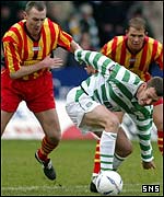 Chris Sutton holds off Thistle's Kevin McGowne
