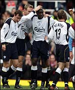 Liverpool celebrate Heskey's goal