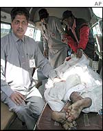 Body of unidentified victim being taken away in ambulance