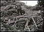 Rescuers dig through the rubble