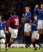 Jean-Louis Valois sends a free kick just wide