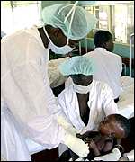 Nurse tends to Ebola victim in Uganda