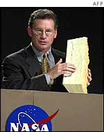 Ron Dittemore displays a piece of insulating foam 