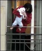 Michael Jackson with his son on a hotel balcony