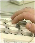 A hand over a computer keyboard