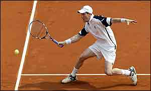 Alan Mackin of Great Britain in action against Mark Philippoussis of Australia during the first rubber of the Davis Cup between Australia and England at the Sydney International Tennis Centre in Sydne