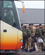 Soldiers board the bus
