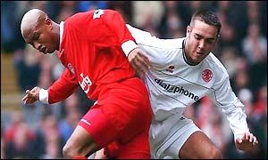 El Hadji Diouf of Liverpool turns past David Murphy of Middlesbrough