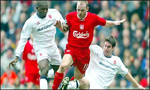 Liverpool's Danny Murphy is sandwiched between Geremi and Chris Riggott