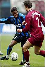 Inter Milan forward Mohammed Kallon of Sierra Leone is challenged by Reggina's Czech player Martin Jiranek