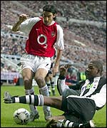 Robert Pires in action against Newcastle's Titus Bramble