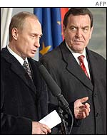 Vladimir Putin (l) with Gerhard Schroeder