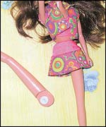 Barbie doll with a broken leg