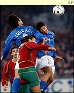 Italy's Bernardo Corradi and Argentine born German Mauro Camoranesi challenges Portugal's Nuno Valente 