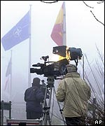 Camera crew waits outside Nato HQ