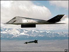 Picture of F-117 nighthawk flying over mountains