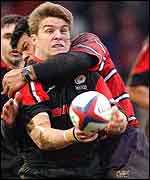 Saracens centre Tim Horan is tackled by Gloucester's Robert Todd