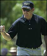 Greg Owen celebrates a birdie during his second round