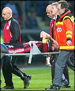 Jens Nowotny is stretchered off against Manchester United 
