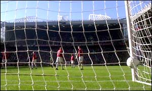The ball flies into the back of the net from Edu's free-kick as Arsenal take a 1-0 lead at half-time