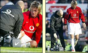 Man Utd midfielder David Beckham is treated before leaving the field injured